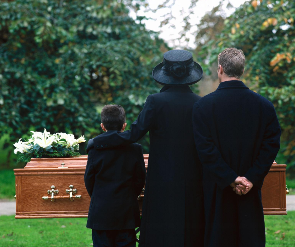 Mom, dad, and son in black standing before a casket | Buying a casket online | Overnight Caskets