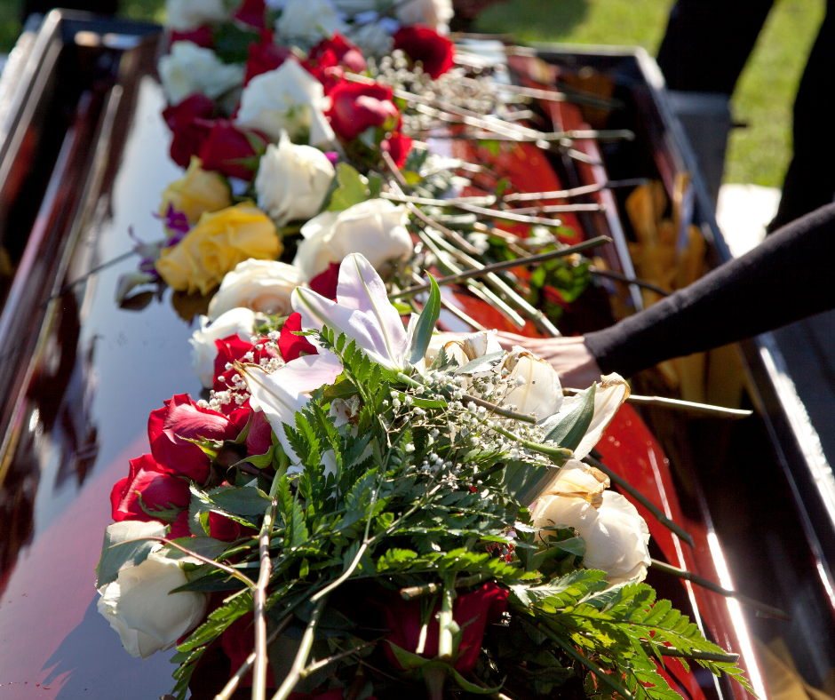 image of flowers on a casket | Funeral Planning During COVID-19 | Overnight Caskets}